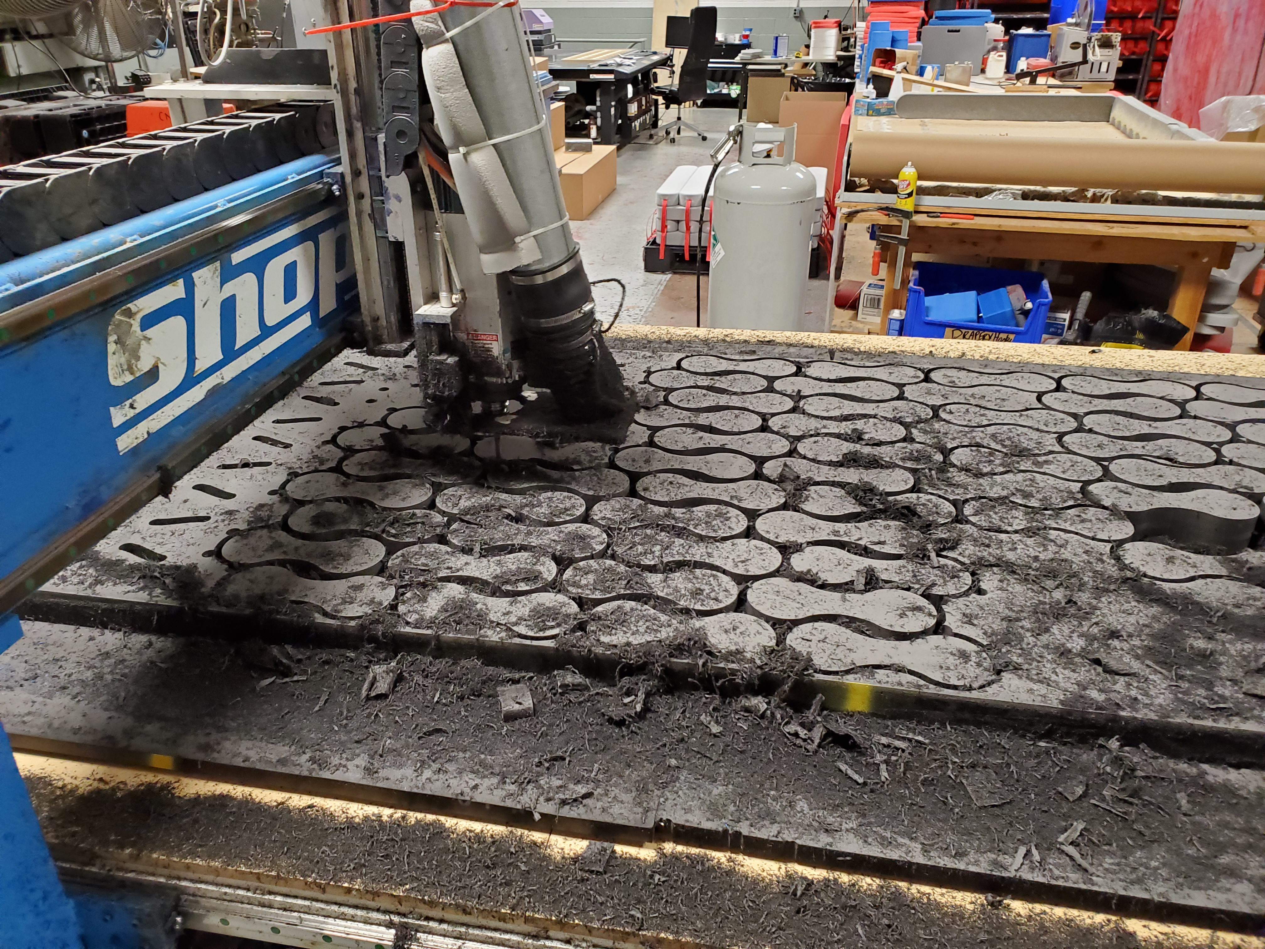 CNC router cutting with chips flying